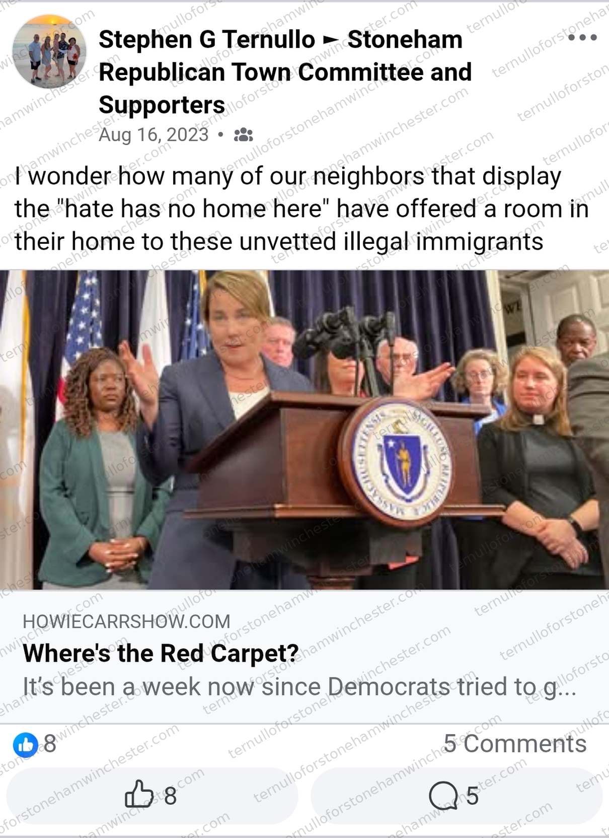 Facebook post in the "Stoneham Republican Town Committee and Supporters" group by Stephen G Ternullo (Aug 16, 2023). Text: "I wonder how many of our neighbors that display the 'hate has no home here' have offered a room in their home to these unvetted illegal immigrants." Attached is a shared link from howiecarrshow.com, with a photo of a woman speaking at a podium bearing the Massachusetts state seal, flanked by several other officials standing behind her, headlined "Where's the Red Carpet?" with preview text "It's been a week now since Democrats tried to g..." No comments are shown, and no redactions appear in the image.